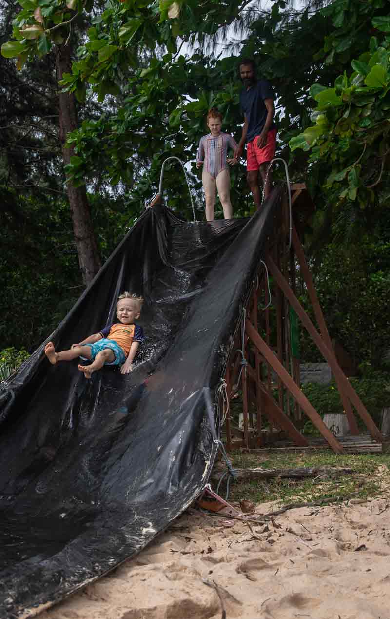 child going down the water slide